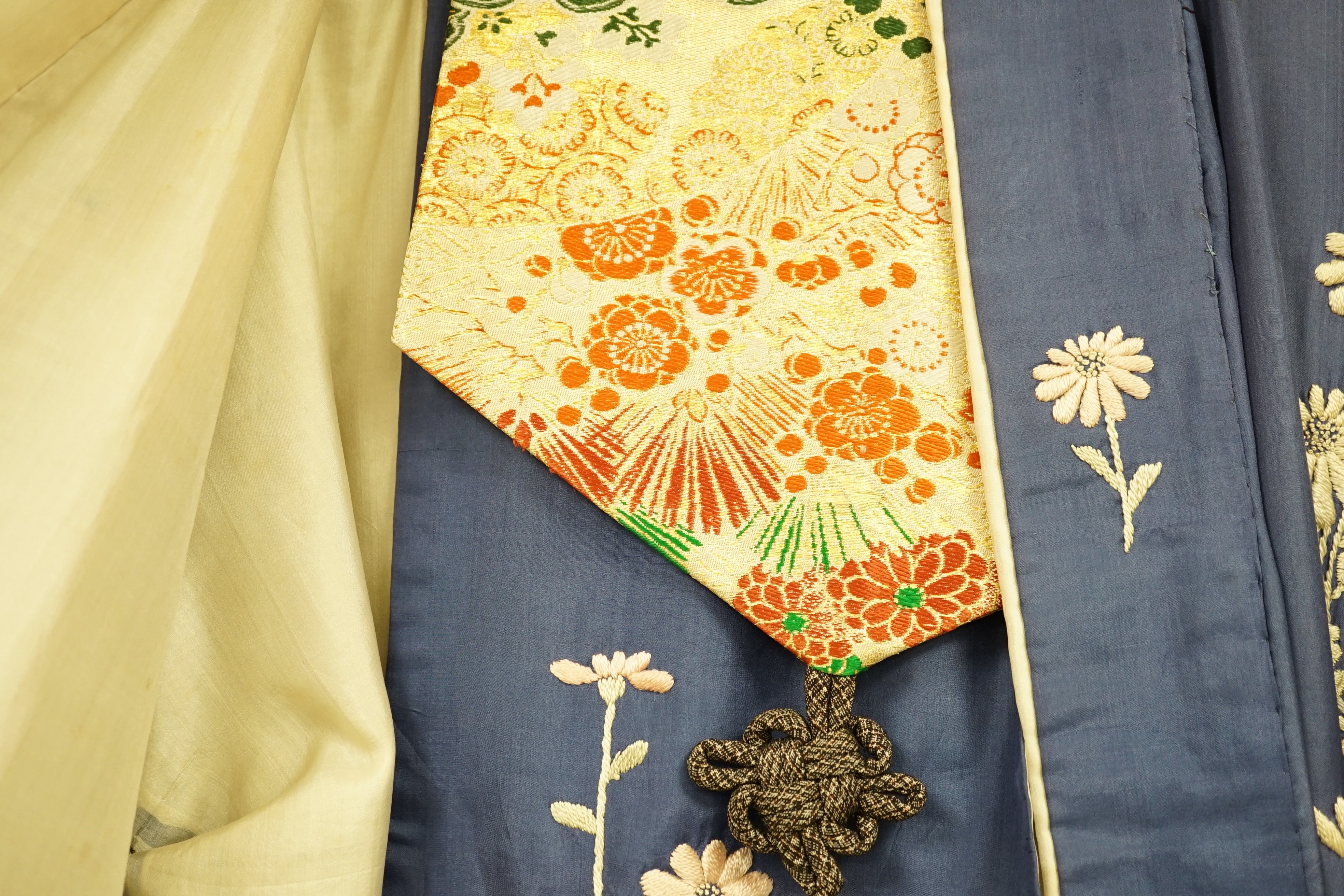 A Japanese embroidered silk kimono and a brocade obi